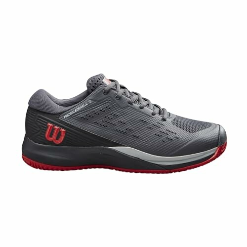 Gray Wilson tennis shoe with red accents.