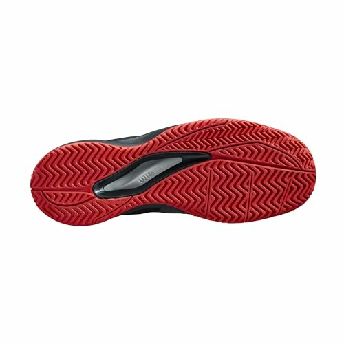 Red and black shoe sole with traction pattern.